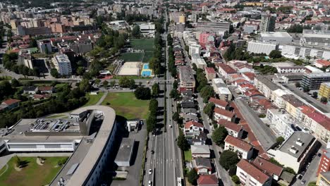 aerial view of braga’s main avenue filled with moving cars on a sunny day in portugal