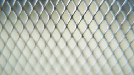 A-hyper-macro-shot-of-a-metal-grid,-steel-pattern,-iron-industrial-texture,-aluminum-material,-super-slow-motion,-Full-HD-120-fps,-tilt-up-smooth-movement,-blurry-Depth-Of-Field