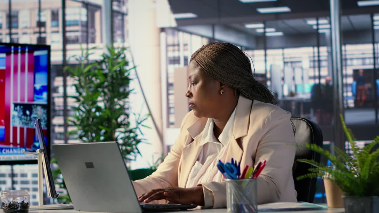 Businesswoman working on laptop in office