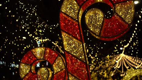 Slow-motion-reveal-of-a-Giant-ornamental-LED-Christmas-"Candy-Cane"-at-Landsdowne-Park,-in-Ottawa,-Canada