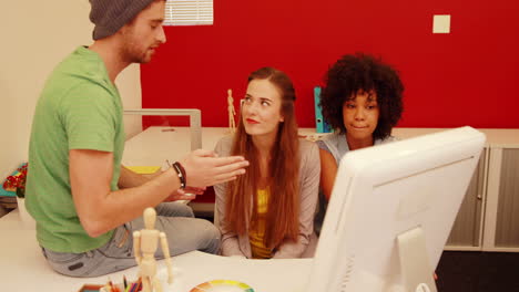 fashion student explaining things to his friends