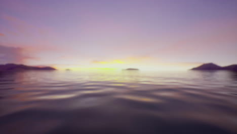 sunset over calm ocean waters with distant islands and soft clouds