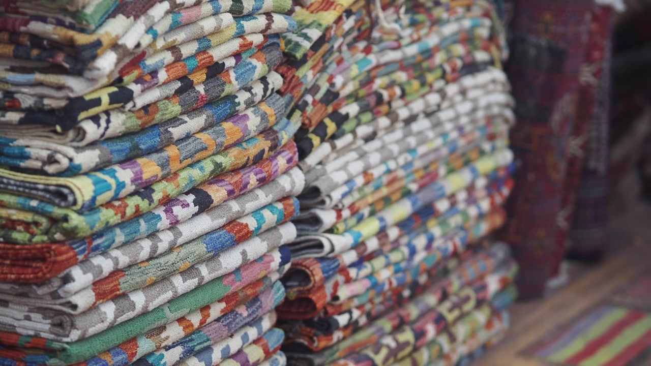 Vibrant Stacked Rugs with Geometric Patterns
