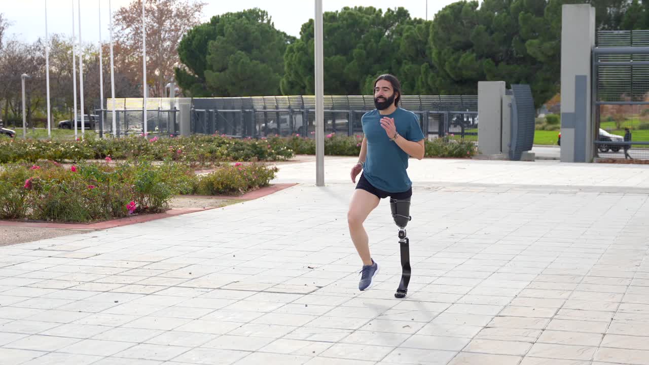 Man with prosthetic leg running outside