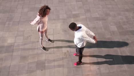 young couple stretching outdoors at dawn