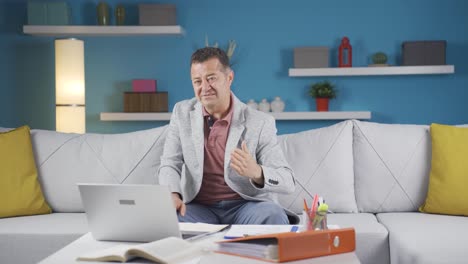 home office worker man looking at camera with disgust and hatred.