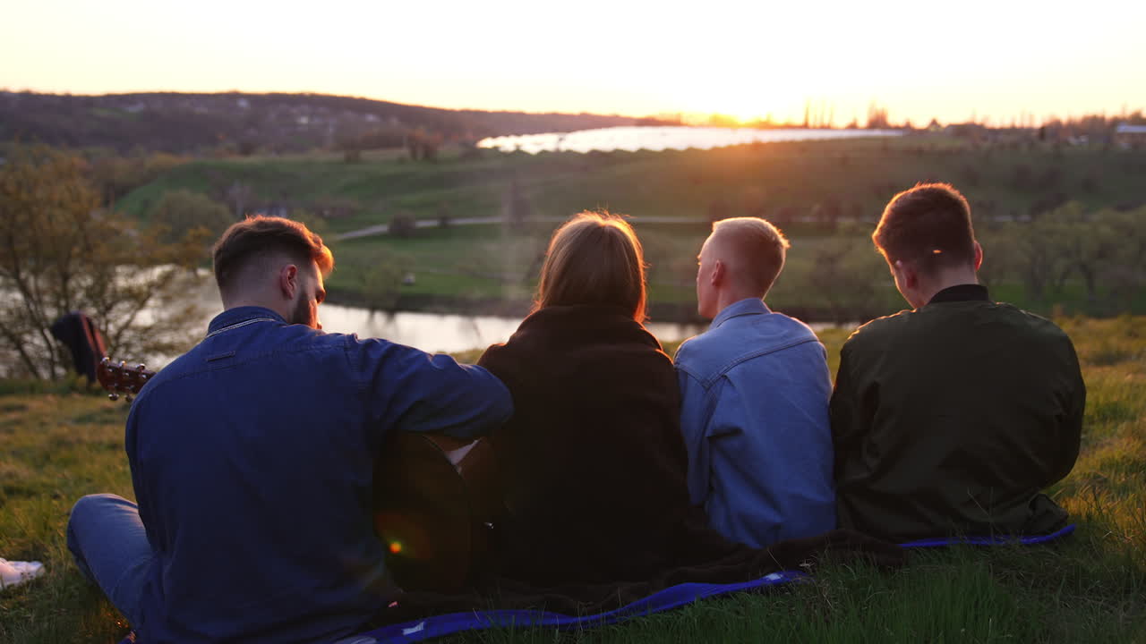 Friends Enjoying Sunset and Music