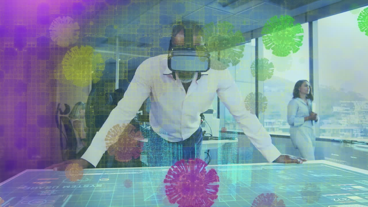 Animation af covid-virusceller over mand med VR-headset, der arbejder på kontor