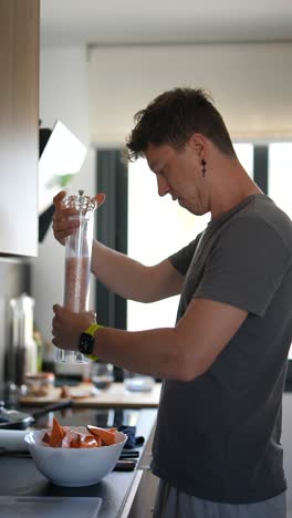 man preparing sweet potatoes in a kitchen