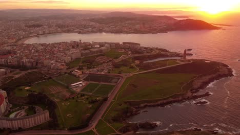 drone fly above la coruna city in north of spain galicia autonomous region, aerial cityscape at sunset