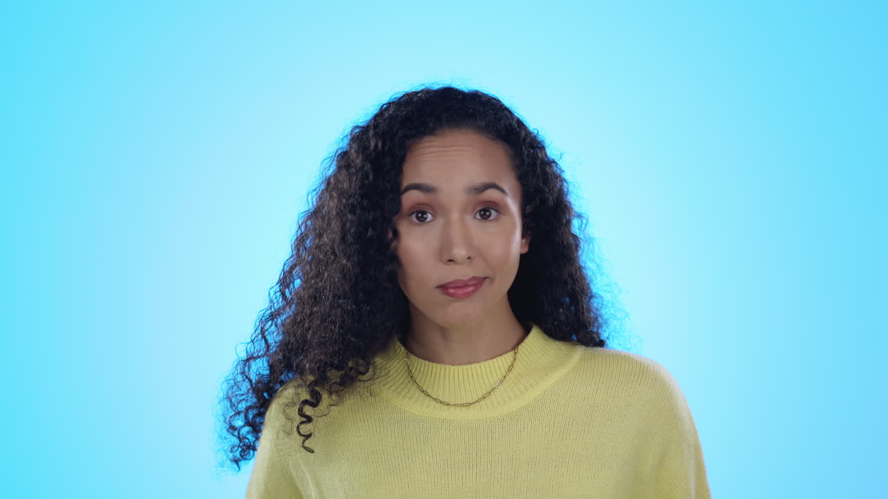 Choice, hands and face of woman in studio confused