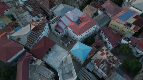 Tilt-Shot-Aerial-view-of-the-Stone-Town,-old-part-of-Zanzibar-City,-main-city-of-Zanzibar-4K-Drone