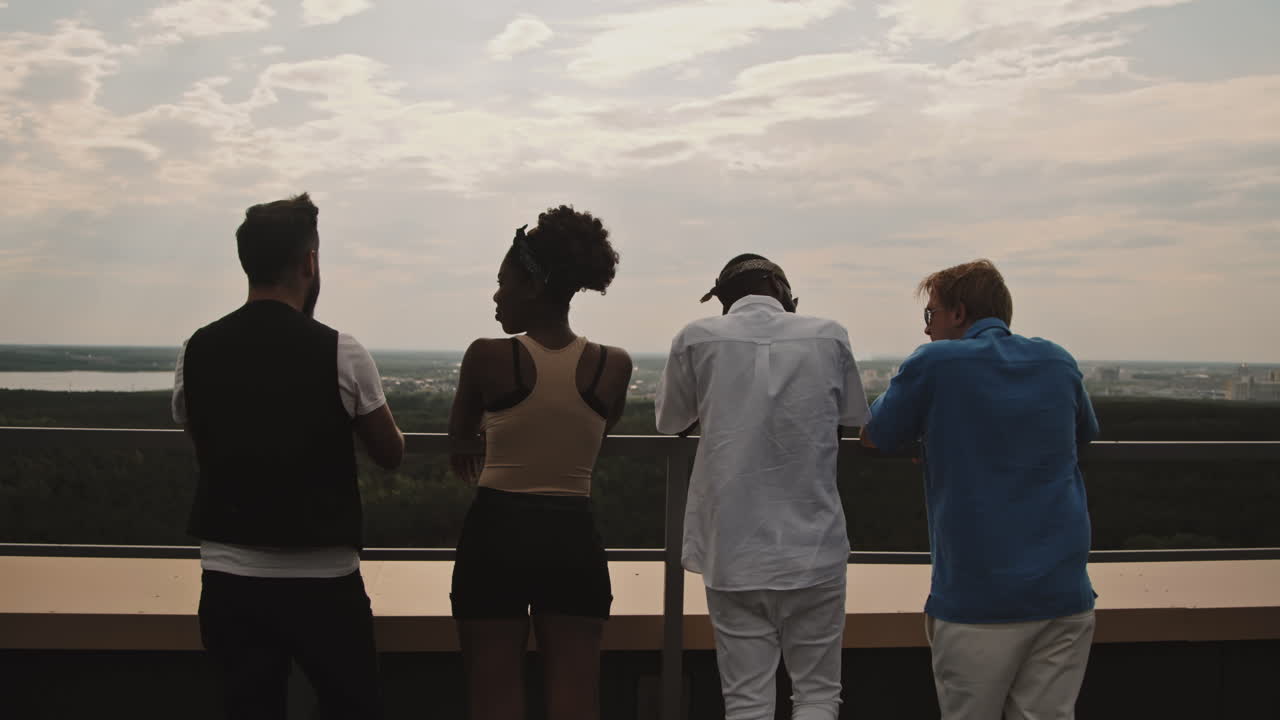 Young People Enjoying View from Rooftop