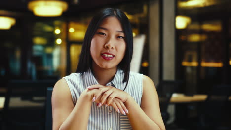 portrait of an asian woman in an office setting