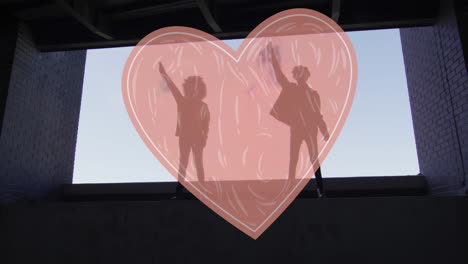 animation of read heart over two woman lifting fists