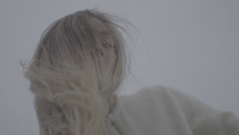 woman with blonde hair in a misty day