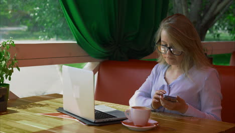 Woman Working in a Cafe