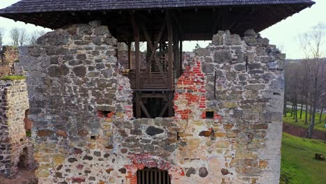 old brick wall of tower of rauna castle ruins in rauna, vidzeme, latvia