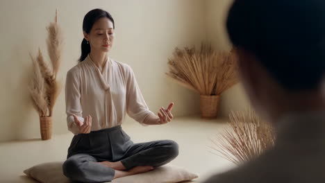 woman meditating in a calm studio setting