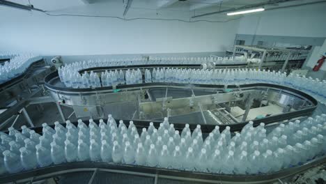 conveyor belt with bottles of drinking water at a modern beverage plant