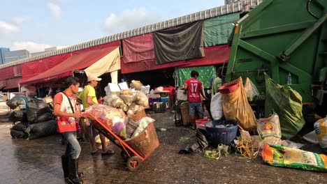 workers sorting and transporting waste outdoors