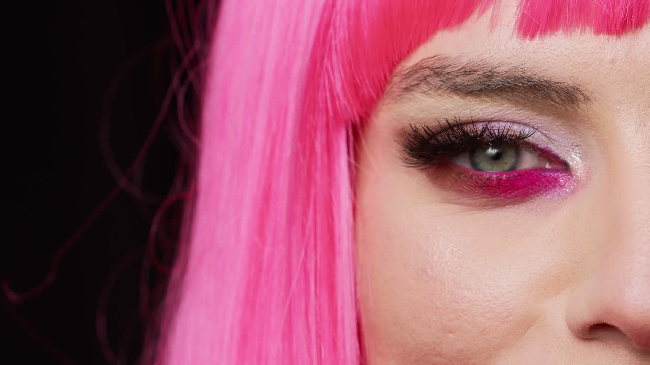 Macro shot of beautiful stylish woman blinking on camera,