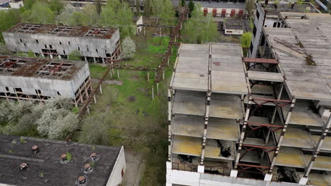 ruined industrial building. old unfinished architecture of a factory. abandoned territory of manufacturing. aerial view.