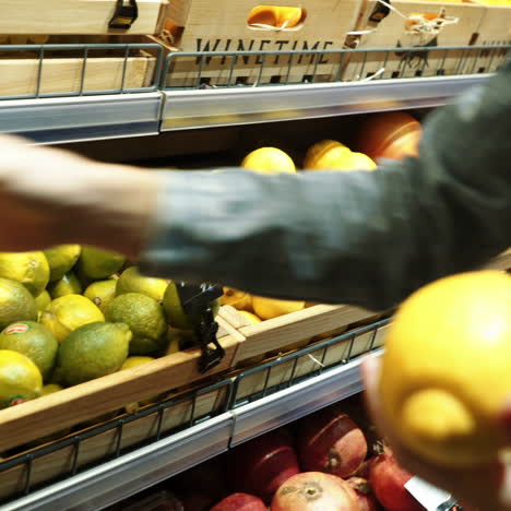 woman's hand chooses fruit and vegetables from a food counter in a supermarket. healthy lifestyle. vegetarianism. proper nutrition. square video