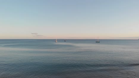Moored-boats-on-sea-at-sunset