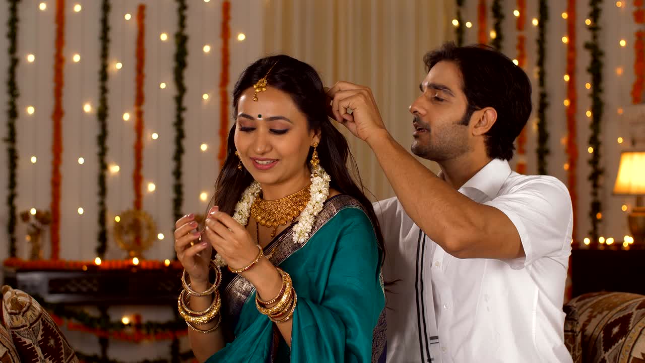 South Indian couple enjoying their quality time on the occasion of Diwali - festival of lights