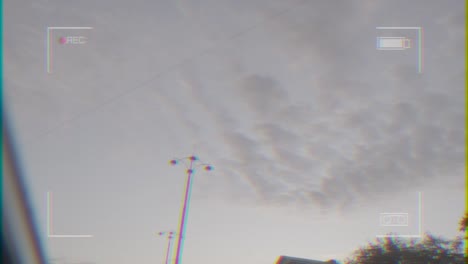 cityscape with lamp posts and cloudy sky