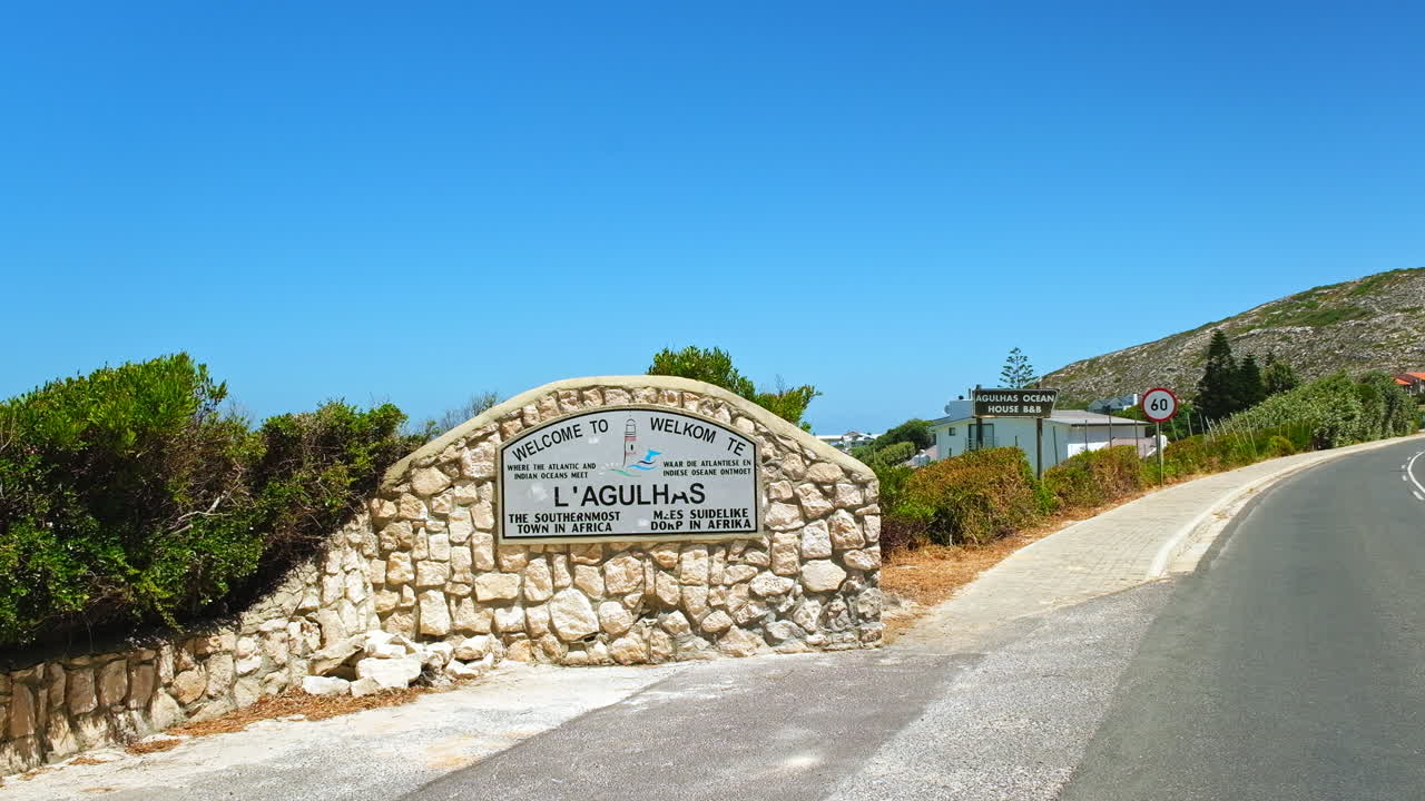 Sign welcoming tourists to L'Agulhas the southernmost town in Africa, static