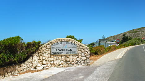 Sign-welcoming-tourists-to-L'Agulhas-the-southernmost-town-in-Africa,-static