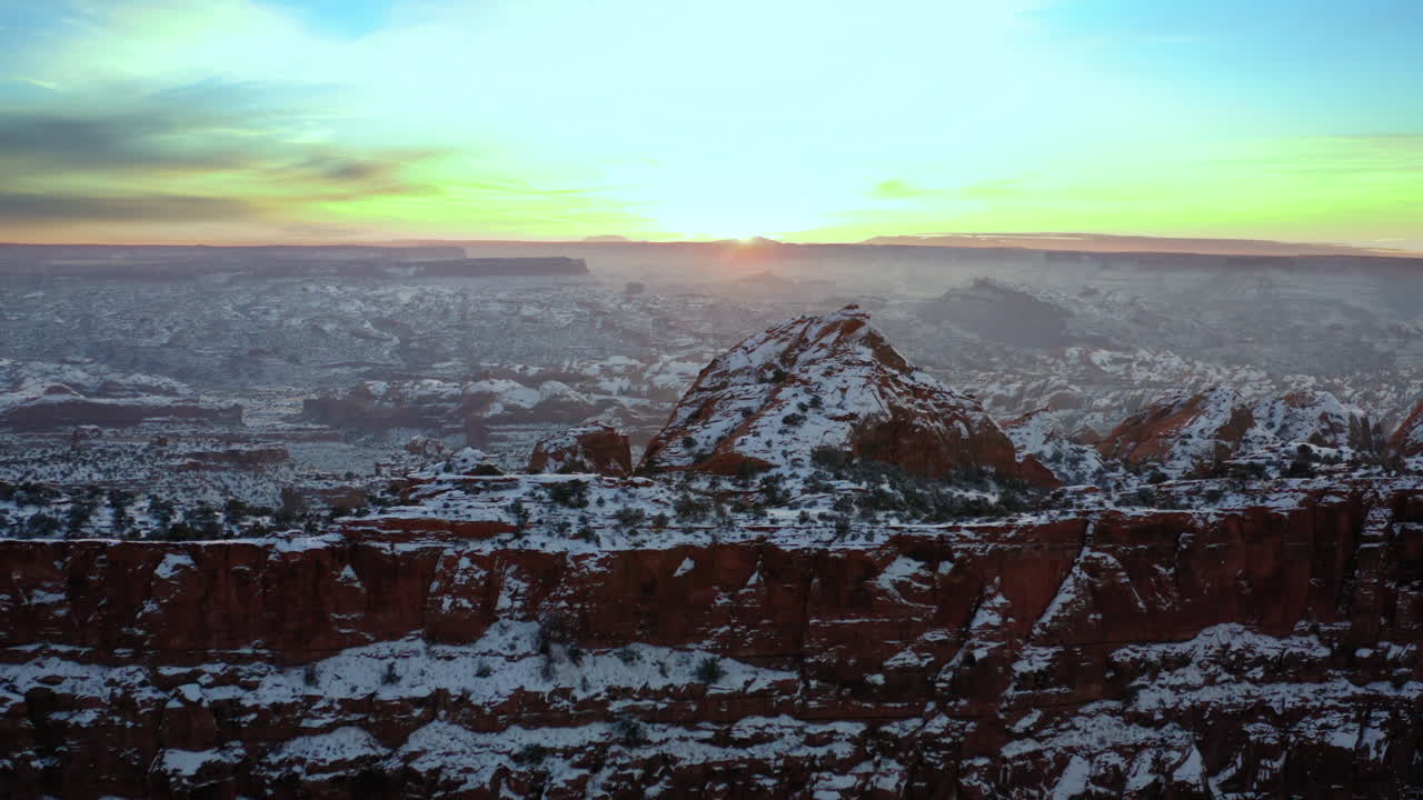 Snow-covered Red Rock Mountains at Sunrise or Sunset