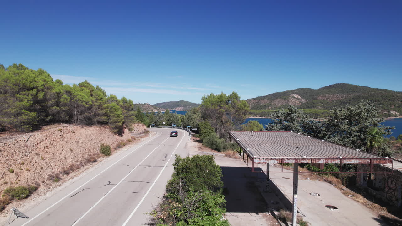 Pedestal shot of abandoned gas station near the Embalse de Entrepeñas reservoir in Spain