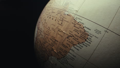 close-up of a world globe focusing on brazil