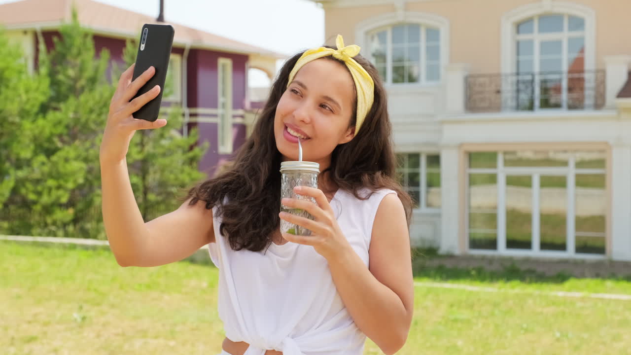 Pretty Woman Taking Selfie With Lemonade Glass