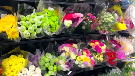 flower rack fridge in florist shop market to keep beautiful colorful bouquet flowers cool at the right temperature in warehouse store open fridge