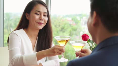 happy romantic couple eating lunch at restaurant