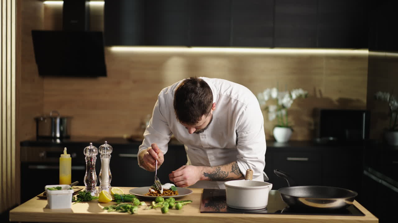 Chef plating a gourmet dish in a modern kitchen