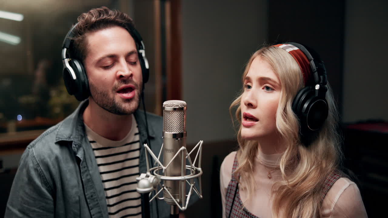 Music studio recording session with vocalists