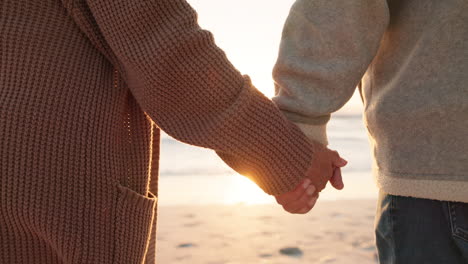 love, beach and senior couple holding hands by