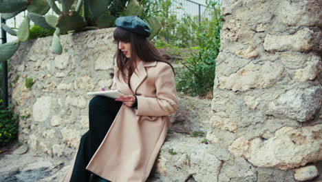 illustrator drawing her sketches outdoor in the small traditional town