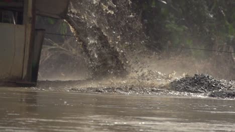 processed sand spewing out of a gold dredger in to the river in checo, colombia-1