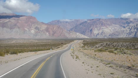 a road leading to the aconcagua in south america, in argentina. dolly in - slow motionroad between mendoza, argentina and chile