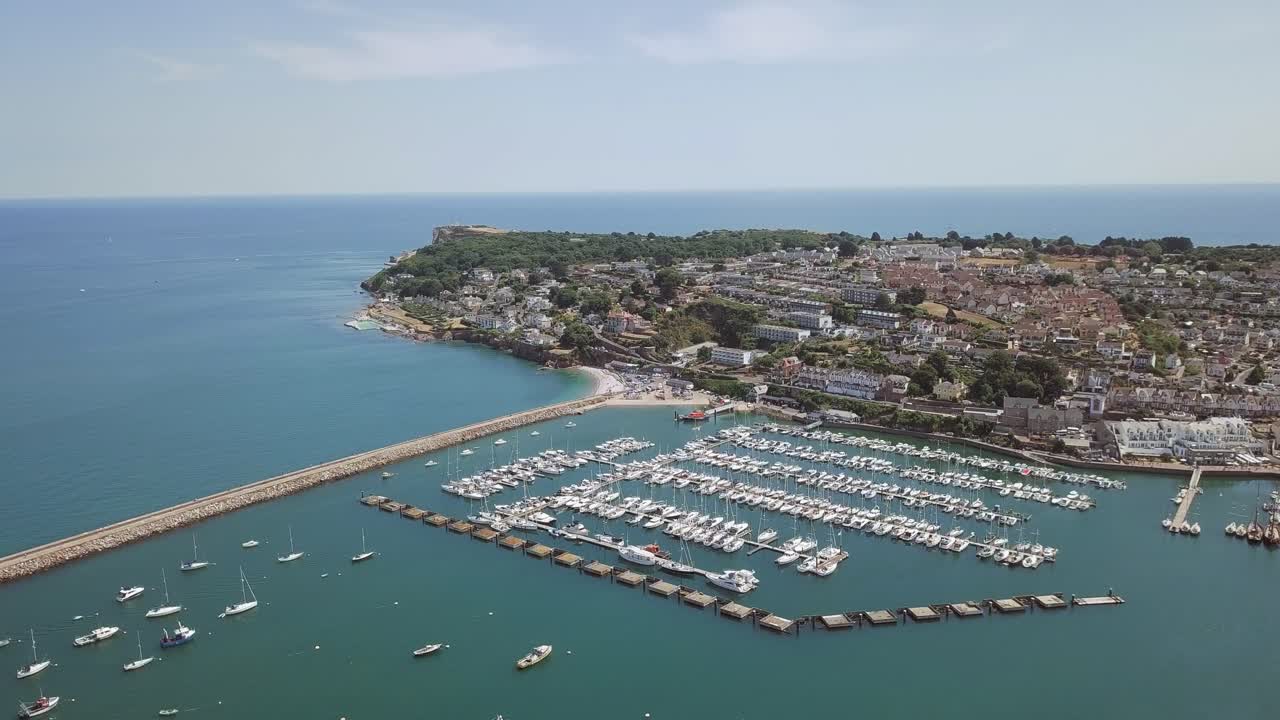 Aerial View of Marina with Boats and Coastal Town