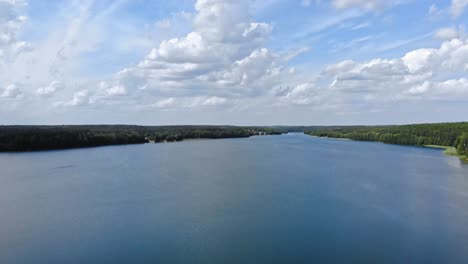 high-altitude flyover of lake jezioro gwiazdy in borowy młyn in kaszuby, pomeranian voivodeship, poland