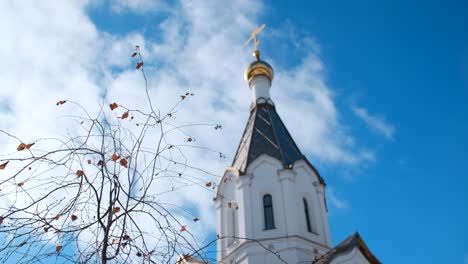 orthodox church tower with cloudy sky