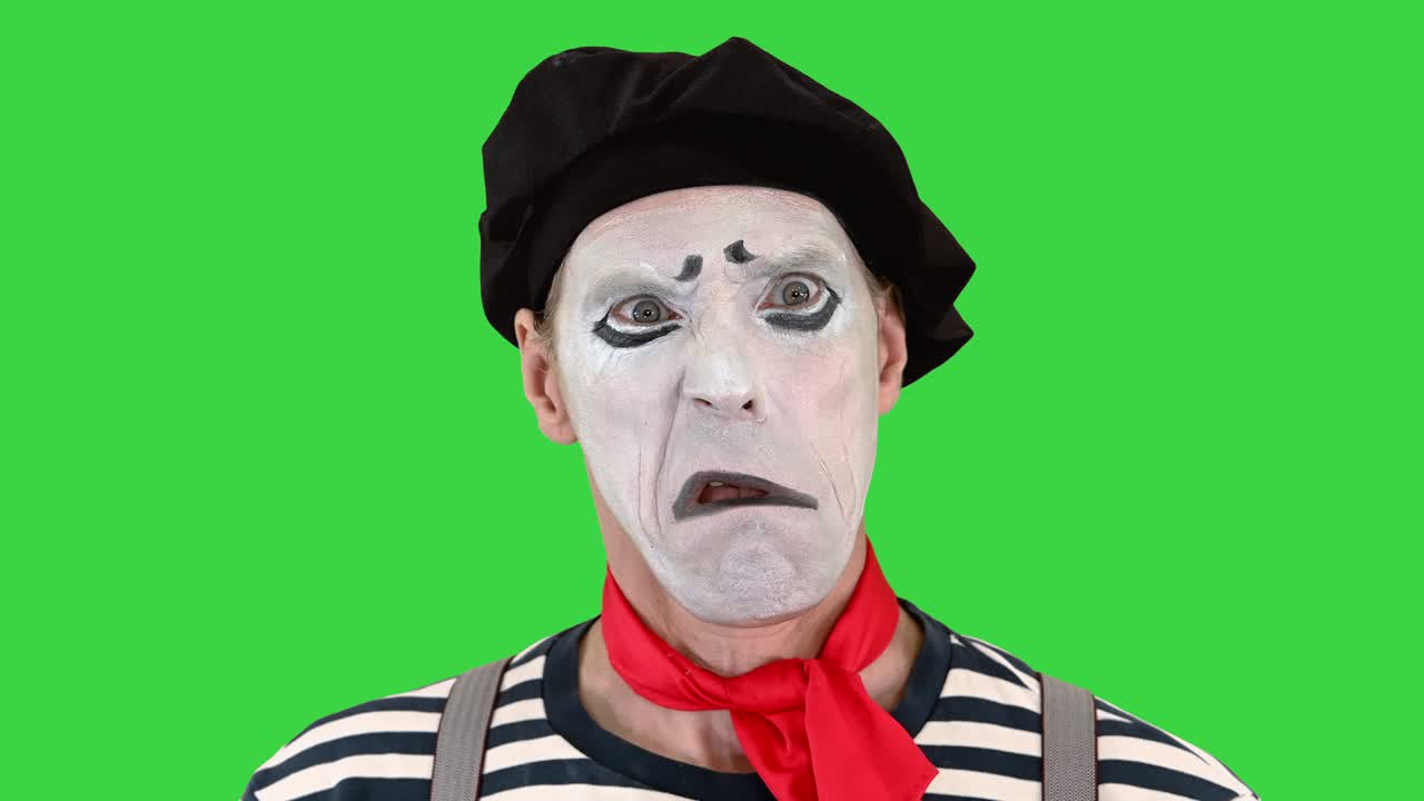 Mime doing different emotions from smiling to being sad on a Green Screen, Chroma Key