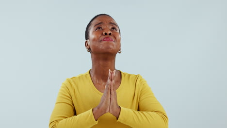 hands, praying and black woman looking up